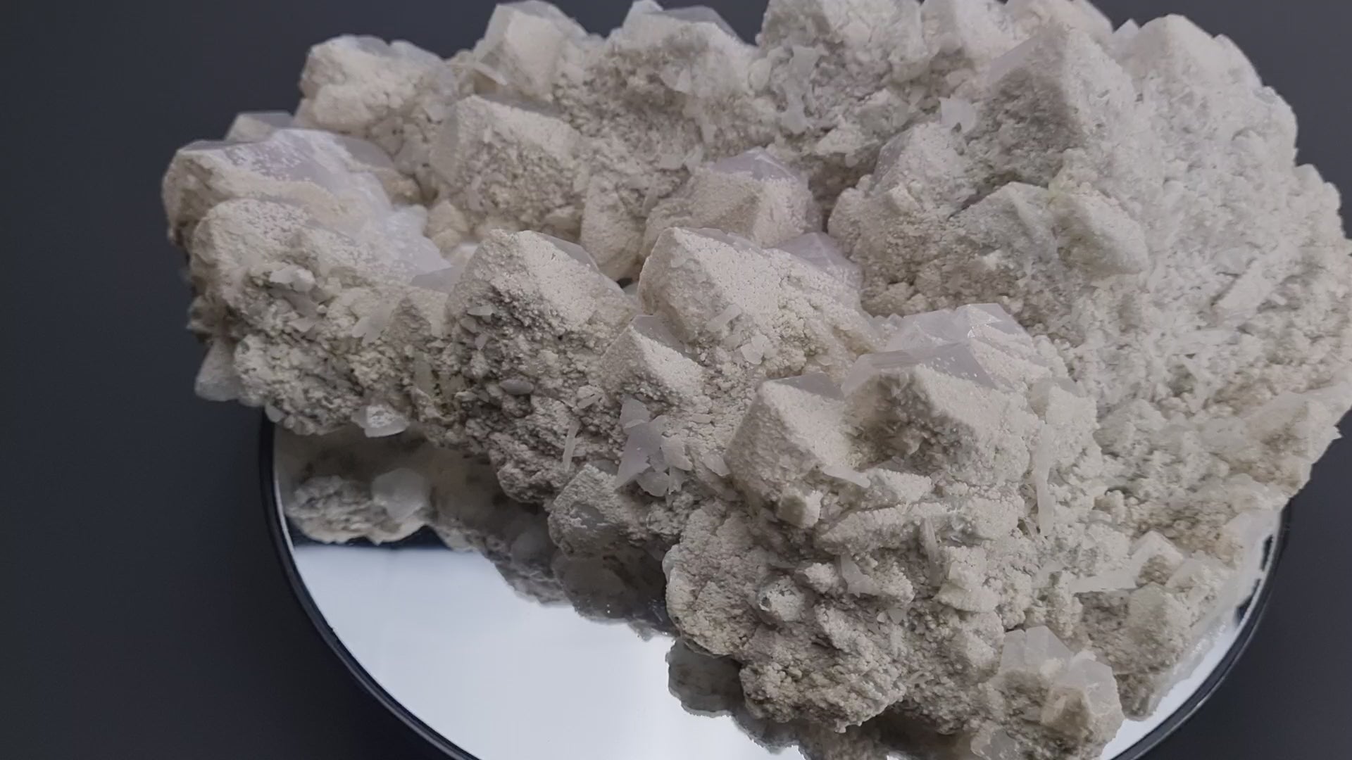 Quartz crystal cluster with a preferential dusting of Calcite and minor Pyrite on matrix